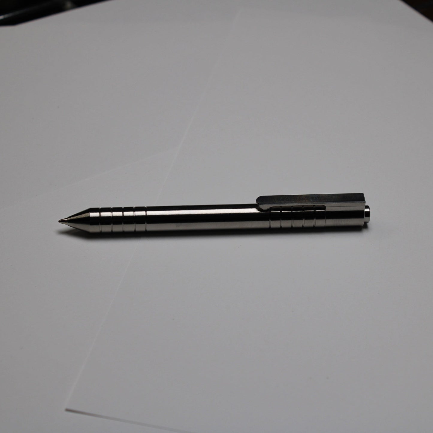 40 Click Clipped Pen - 6Al-4V Titanium - 6061 Aluminum Button - Conical Nose - ISO G2 (Parker)